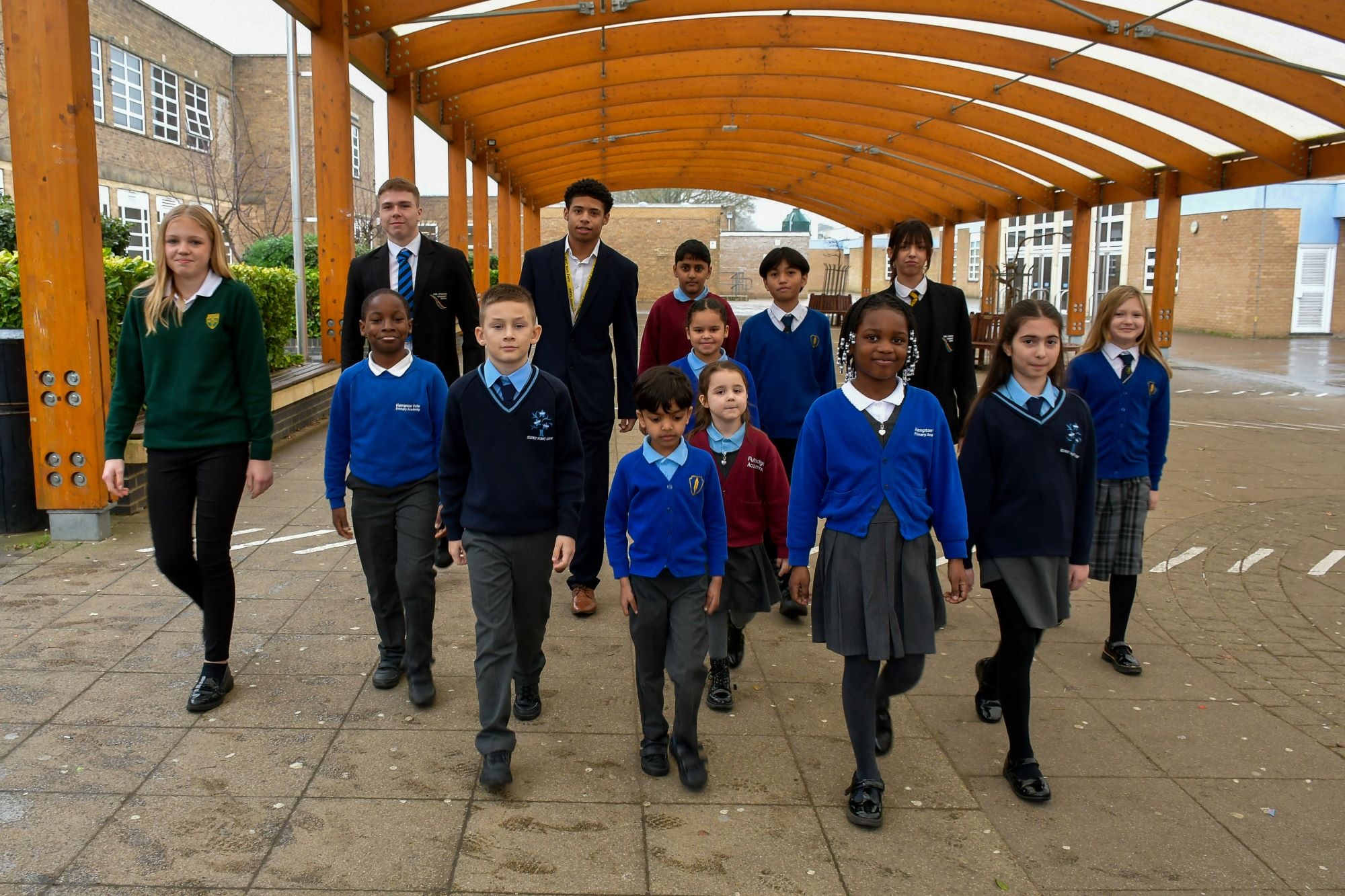 Students from each school walking towards you